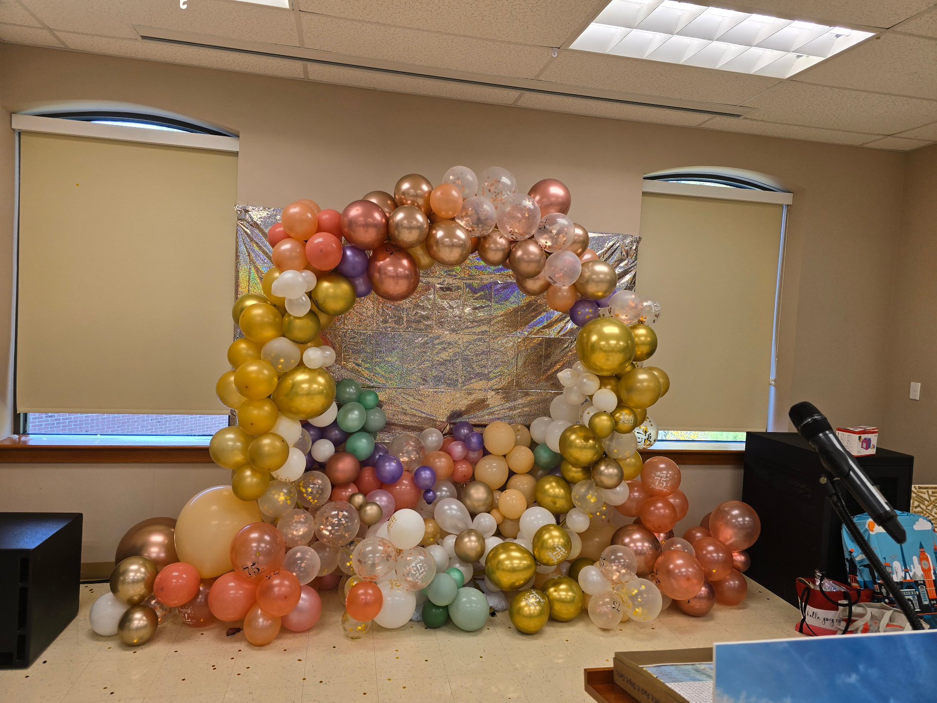 Rose gold, blush and gold balloon arch with iridescent shimmer backdrop by Simone's Creations DMV